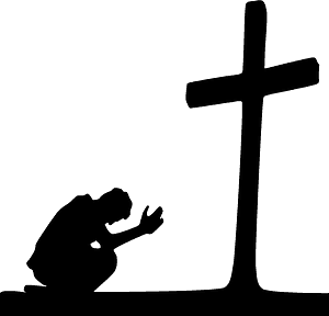 Man praying at the cross