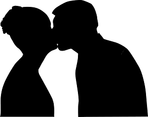 Silhouette of a couple kissing