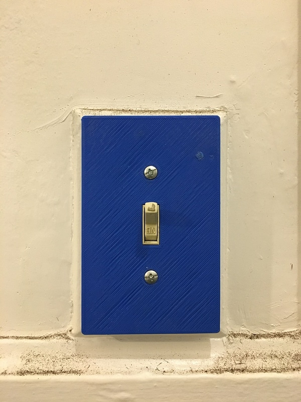 Cover plate for traditional American light switch