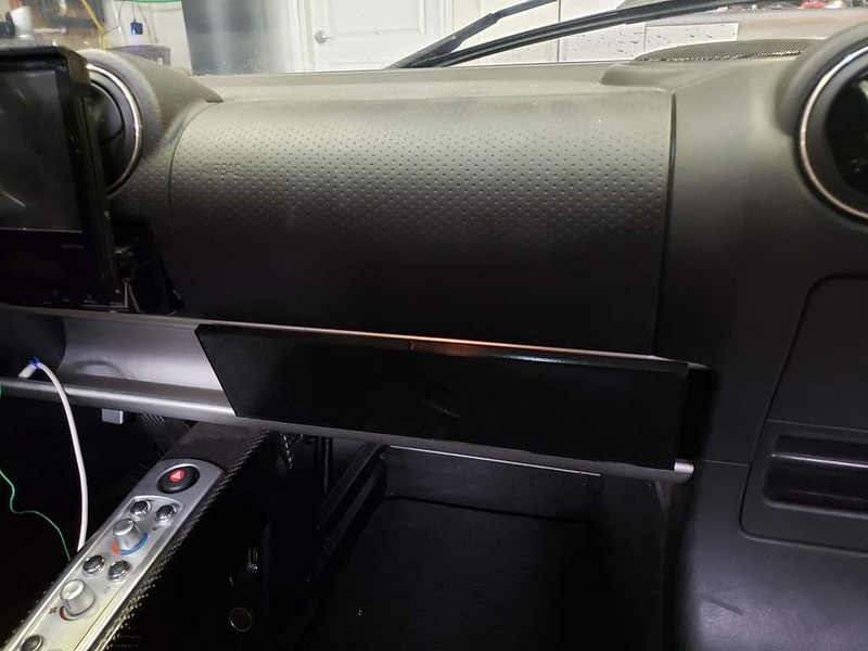 tesla roadster (possibly lotus elise) glove compartment