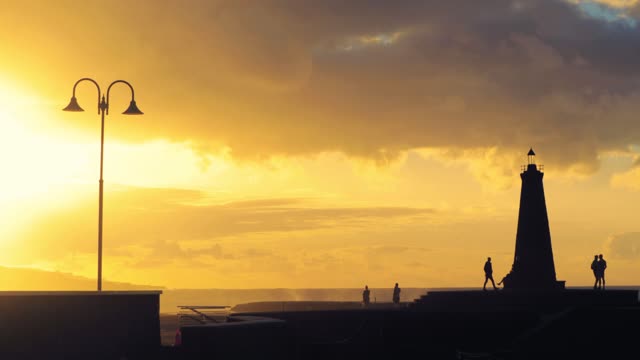 Sea front wave splash sunset