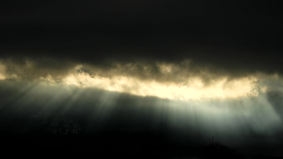 Reflection of sun clouds moutains