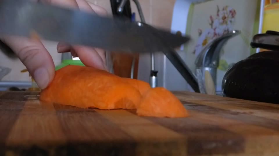 Cutting carrots into slices chef cook