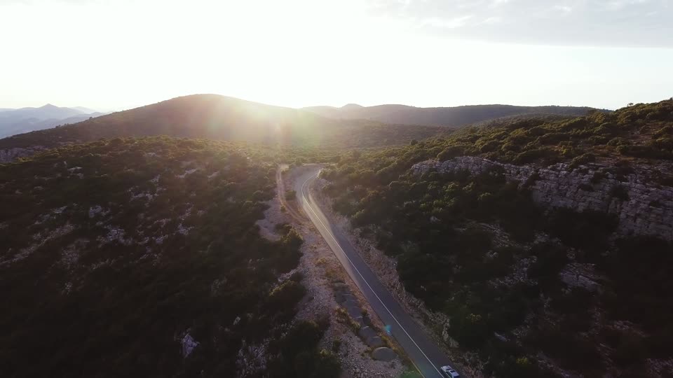 Car driving sunset