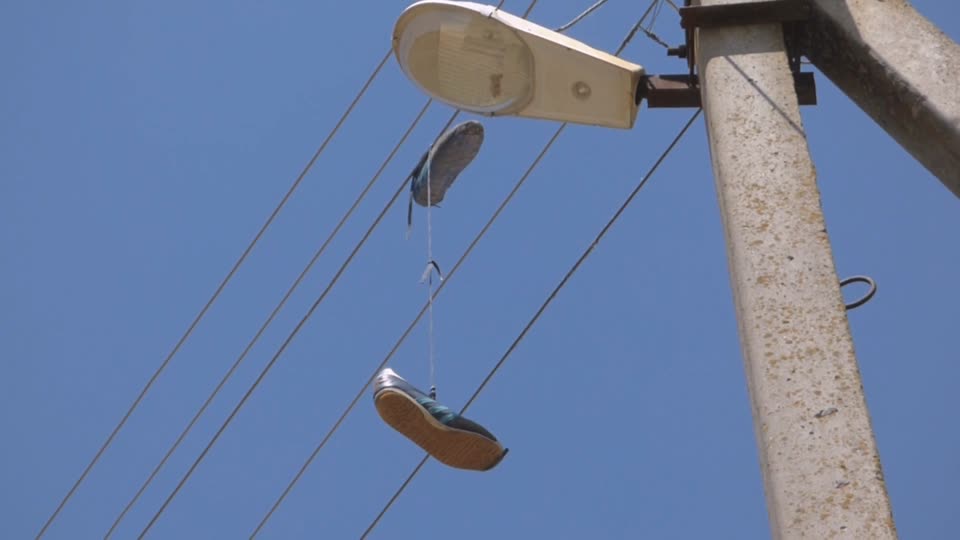 Sneakers lamppost pillar
