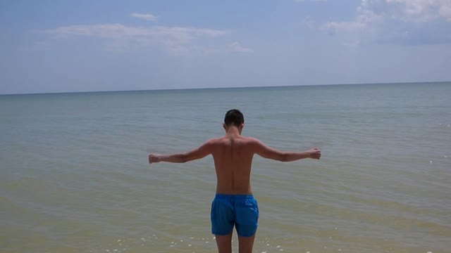 Young man boy sea