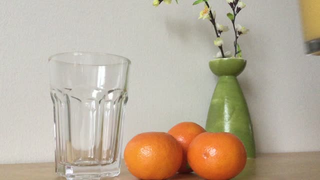 Orange juice pouring drink
