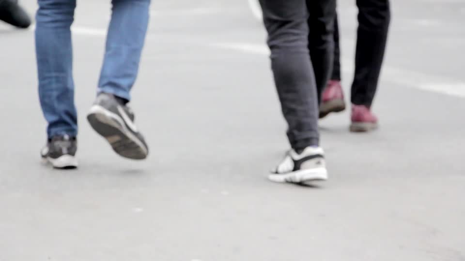 Walking pedestrians legs
