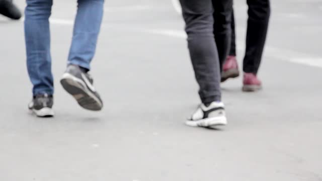 Walking pedestrians legs