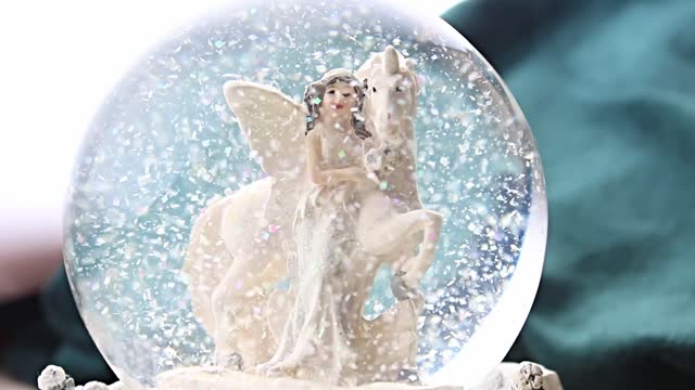 Snow globe unicorn elf