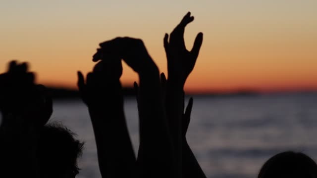 Hands sunset beach