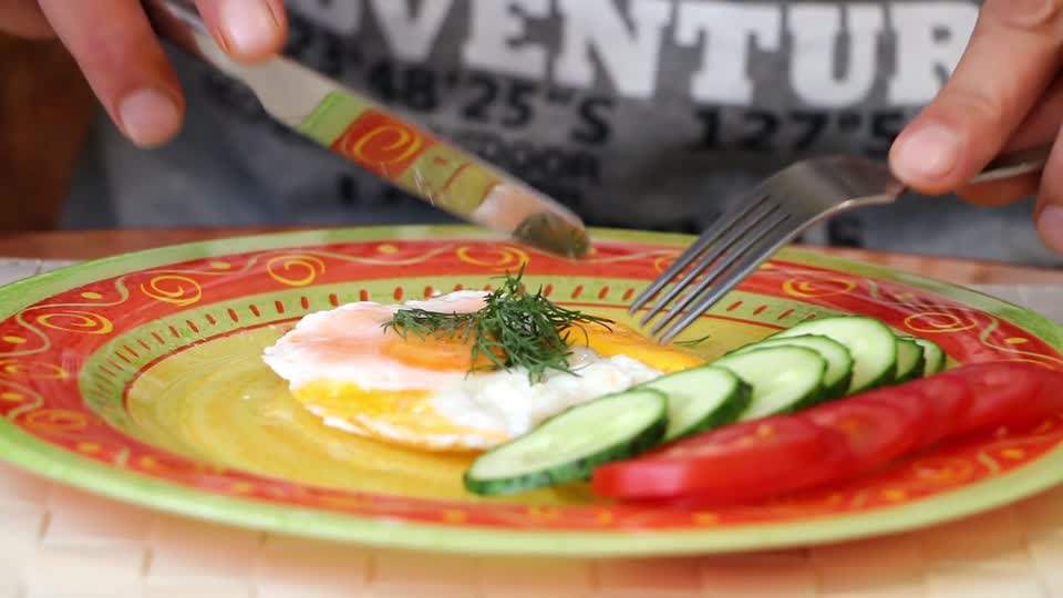 Scrambled eggs plate cucumbers