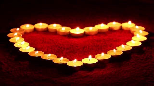 Candles a heart flame