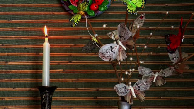 Candle butterflies fire