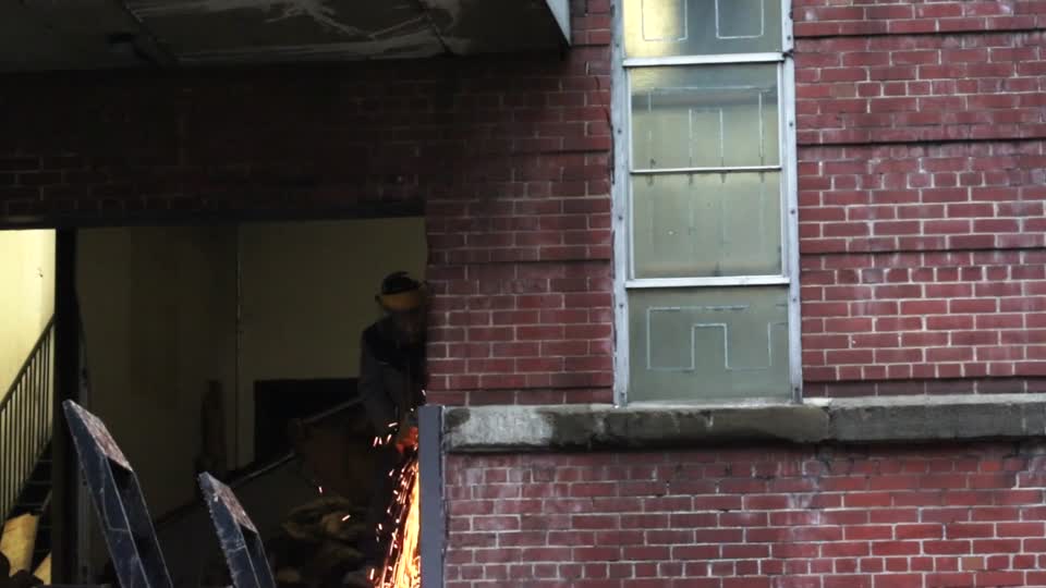 Construction worker angle grinder grinder