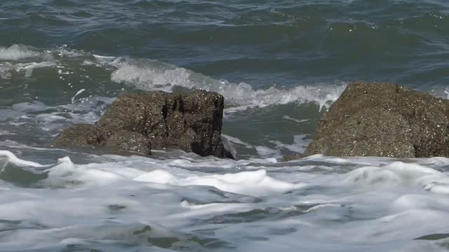 Waves rocks splashing