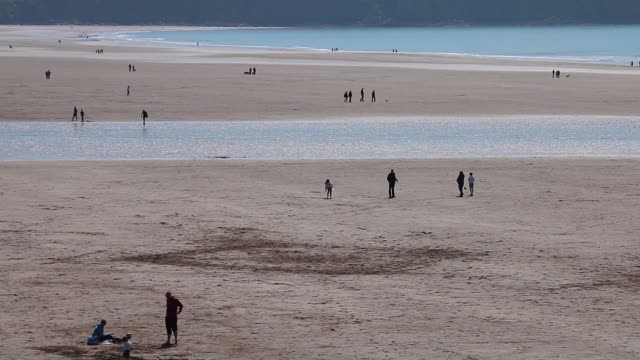 Beach people playing
