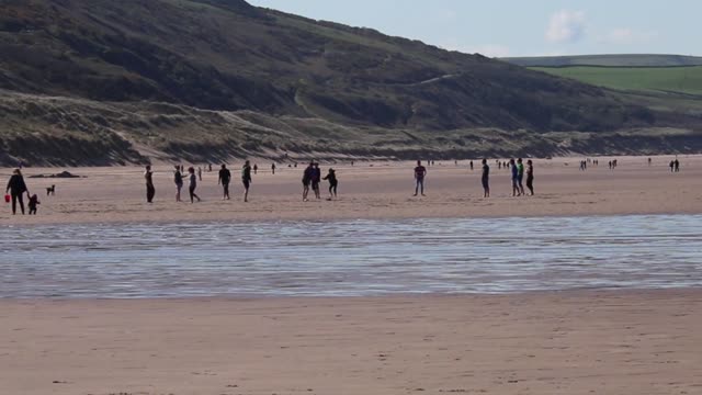 Beach people playing