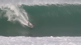 Surfer waves ocean