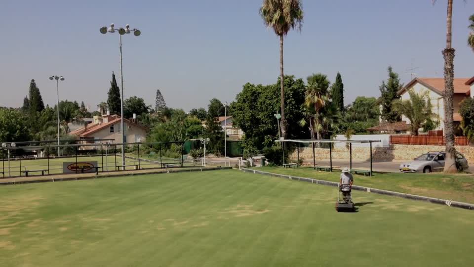 Lawn mower mowing lawn