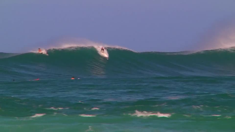 Surfing waves surf-riding