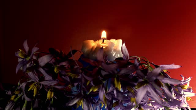 Candle calls wood fire