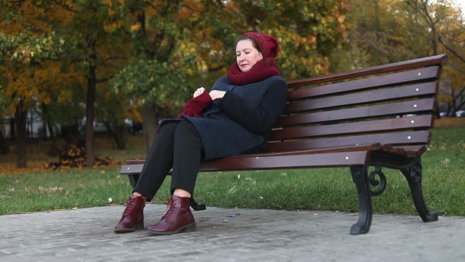 Autumn young woman bench