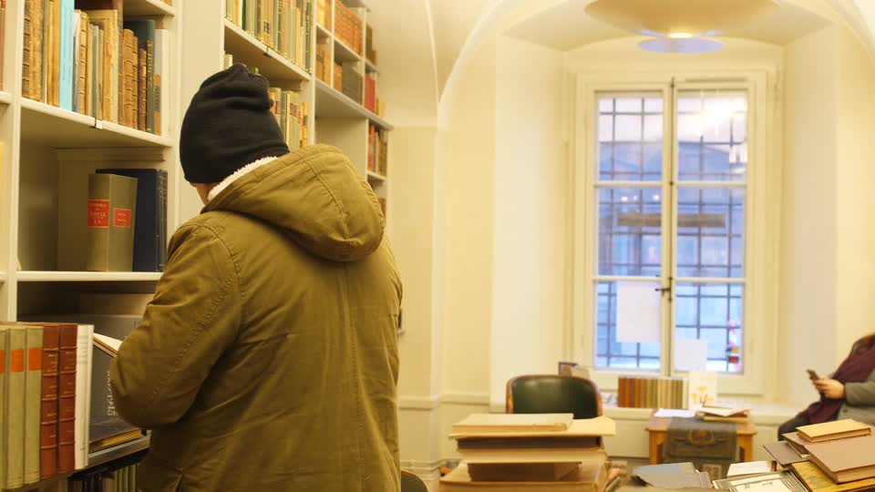 Boy reading library