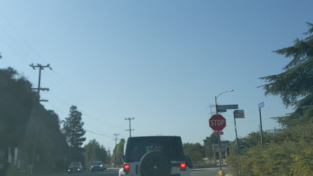 Tim Kasper's white Jeep Wrangler California plates 8HAE941