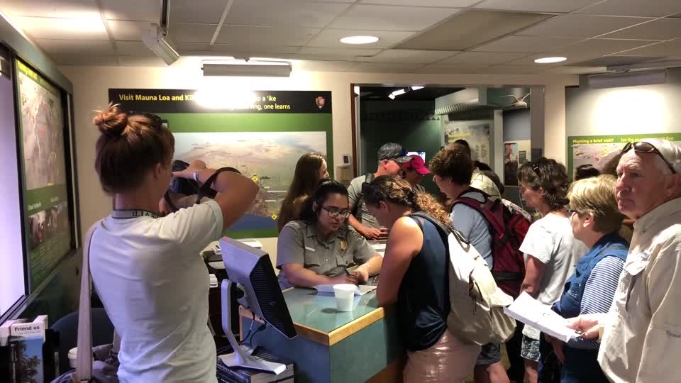 B-roll of Kīlauea Visitor Center park visitors and ranger