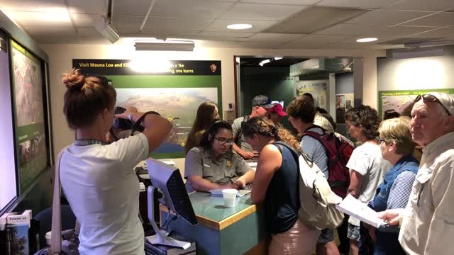 B-roll of Kīlauea Visitor Center park visitors and ranger