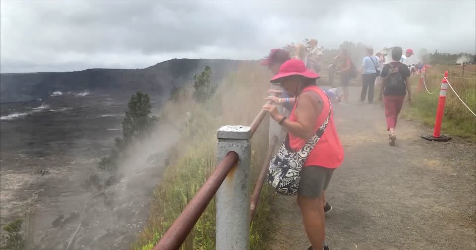 Visitors enjoy volcanic steam at Steaming Bluff