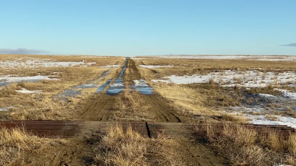 NW Road pan right to fence line