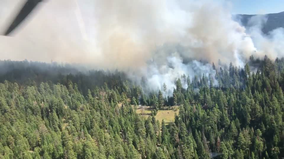A helicopter fly over the Canyon 66 Prescribed fire