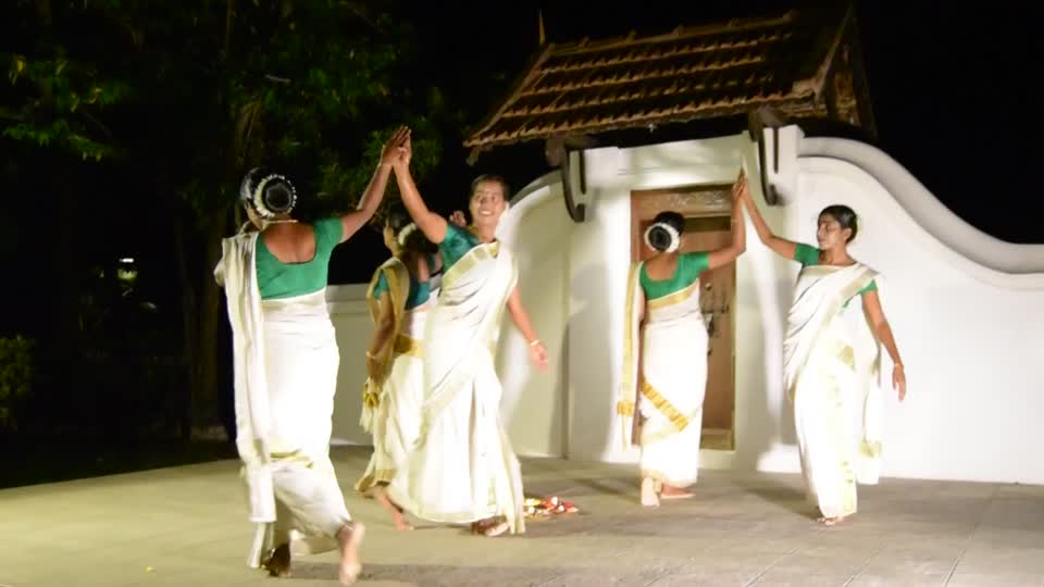 India. Kerala. Kumarakom. Coconut Lagoon on the shore of Lake Vembanad. Local song and dance troupe.
