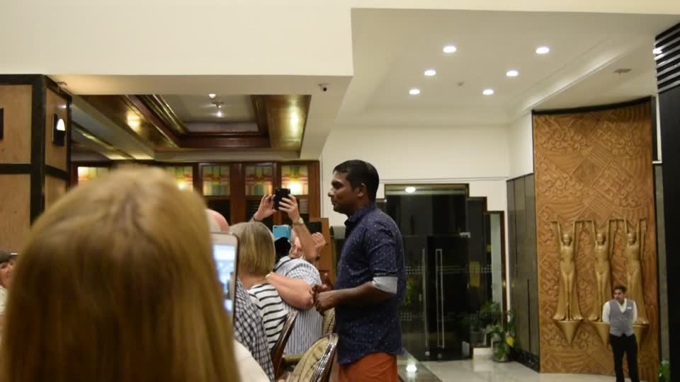 India. Bangalaru (Bangalore). Le Meridian hotel. Our farewell dinner.  Our toour group leader sang to us in Tamil.  It did sound quite sad at the time.