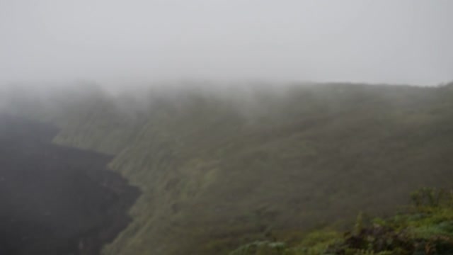 Ecuador. Galapagos. Isabela Island.  The view started to be lost. We were lucky if our departure was another 30 minutes we would not have seen the inside of the caldera.