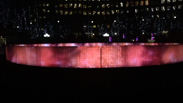 Winter Lights at Canary Wharf. London. "Lactolight". Music controlled lighting, changes occur on the wall..  VIDEO.