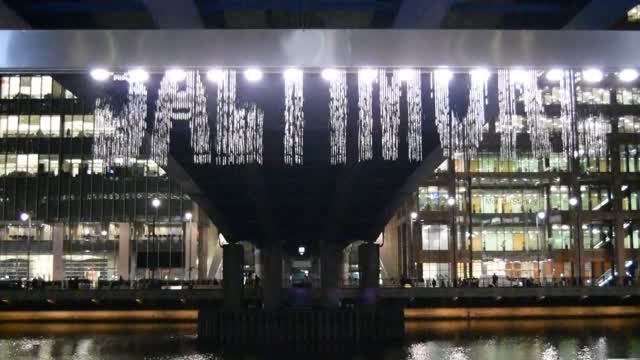 Winter Lights at Canary Wharf. London. This is called "Bit Fall".  It is a waterfall of sorts, which display words as it falls.  Some clever programing, I think. VIDEO.