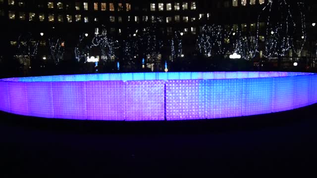 Winter Lights at Canary Wharf. London. "Lactolight". Music controlled lighting, changes occur on the wall..  VIDEO.